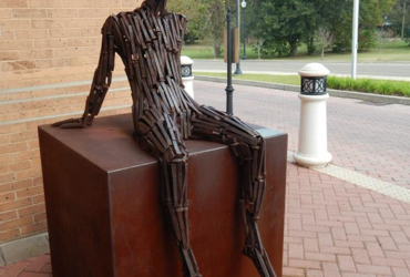 sculpture made of spikes in the shape of a man